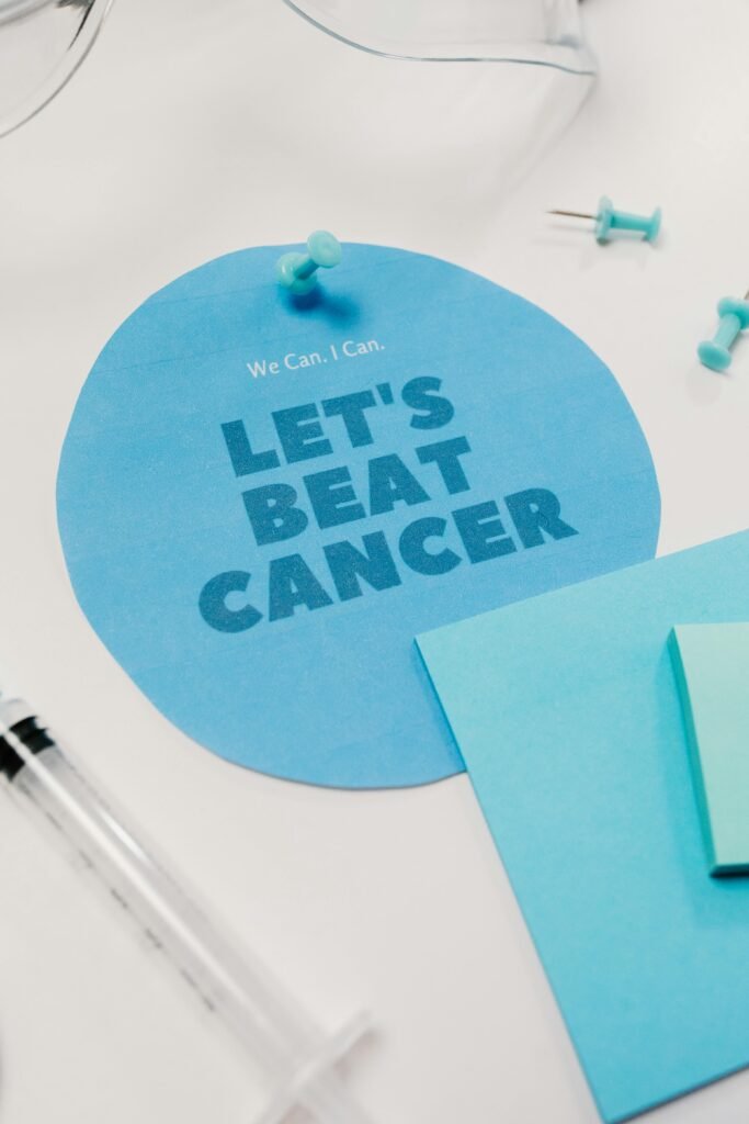 Inspirational 'Let's Beat Cancer' poster with a medical theme.